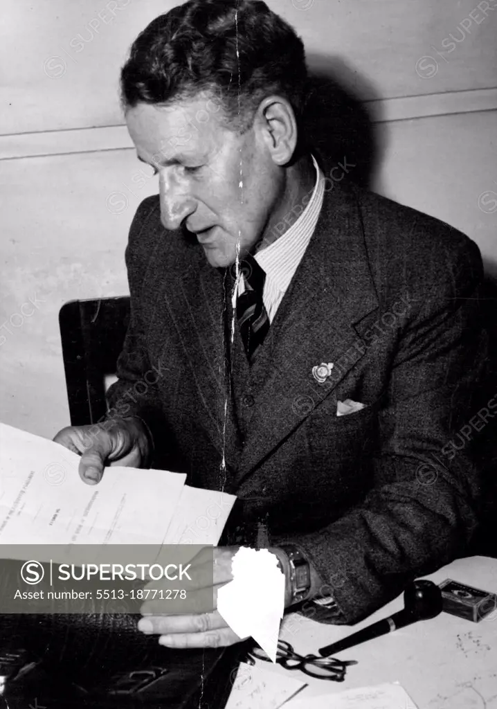 The Leader of the Opposition (Senator Cooper) was getting together information on Electoral Statistics. October 10, 1947. (Photo by The Courier Mail Brisbane).