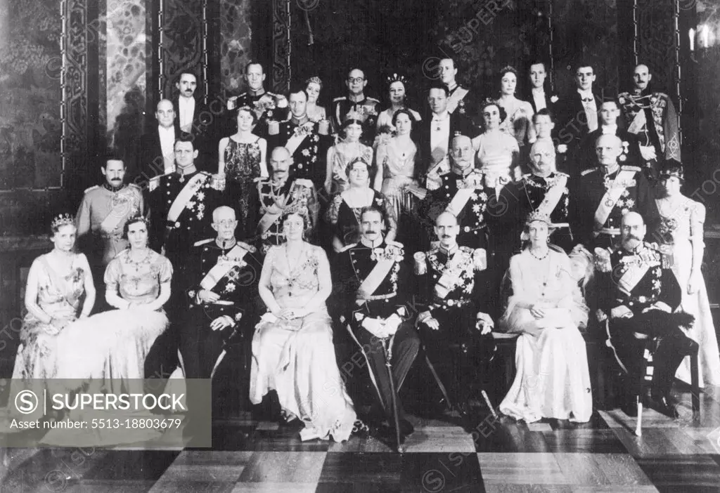 Photo Shows:- The official picture of the three Royal Families taken at Christiansborgs  Castle, Denmark, after the gala dinner in celebration of the jubilee. In the front row (starting second from left) are - left to right - Crown Princess Ingrid of Denmark; King Gustav of Sweden; Queen Alexandrine of Denmark; King Christian of Denmark; King Haakon of Norway; and Princess Ingeborg of Sweden.Three Royal Families at Jubilee Of Danish King.The three Scandinavian Monarchs - King Christian (Denmark), King Gustav (Sweden), and King Haakon (Norway) - gathered together with members of their families in Copenhagen for the jubilee Celebrations of king Christian.  May 18, 1937. (Photo by Planet News Ltd).