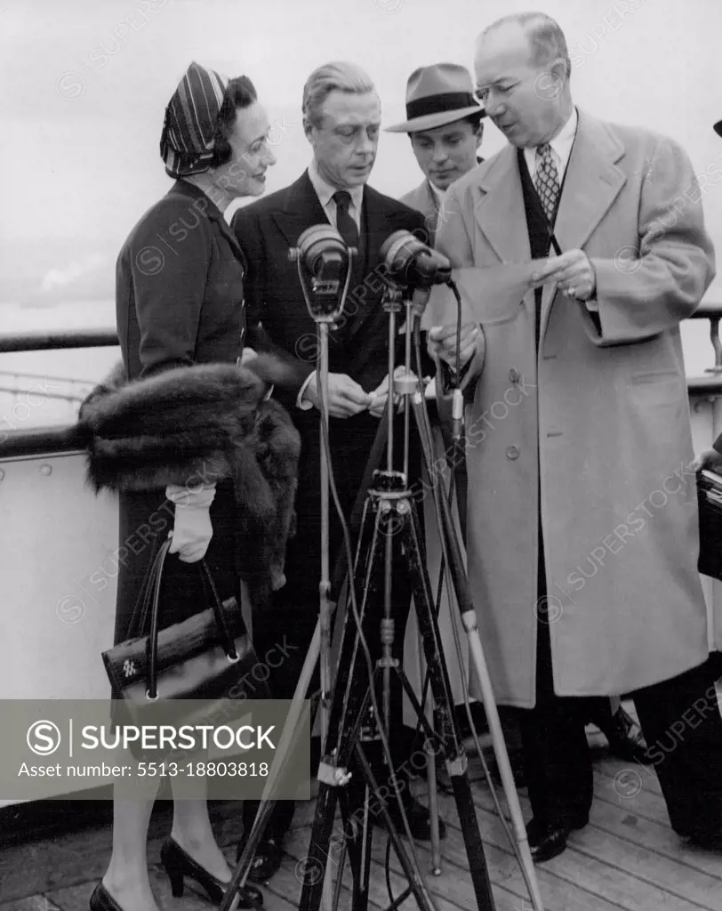 The Windsors' Hello to the U.S.A.The Duke and Duchess of Windsor go through the script of a greeting broadcast to the U.S.A. on the deck of the "Queen Elizabeth" before docking in New York Harbour. November 14, 1946.