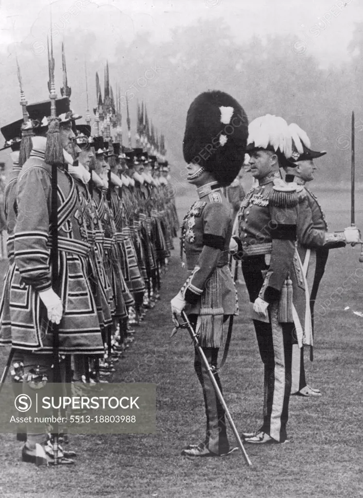 Official Photograph.The King Inspects Yeomen of the Guard in the grounds of Buckingham place. This is the First time for many years that the Reigning sovereign has inspected this ancient body of Men. H.M. King Edward VIII inspecting the King's Bodyguard of the Yeomen of the Guard seen in their picturesque uniform. June 26, 1936.  (Photo by Sport & General Press Agency, Limited).