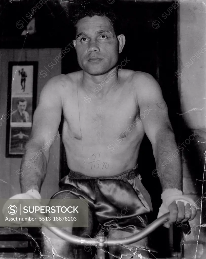 Australian lightweight champion Jack Hassen in training this week for his fight against welter champion Mick Tollis at the Stadium on Monday night.He was an expressionless boxer, not winning when a blow got through and not saying anything as he sat upright in his corner between rounds. March 17, 1951. (Photo by Sporting Life).