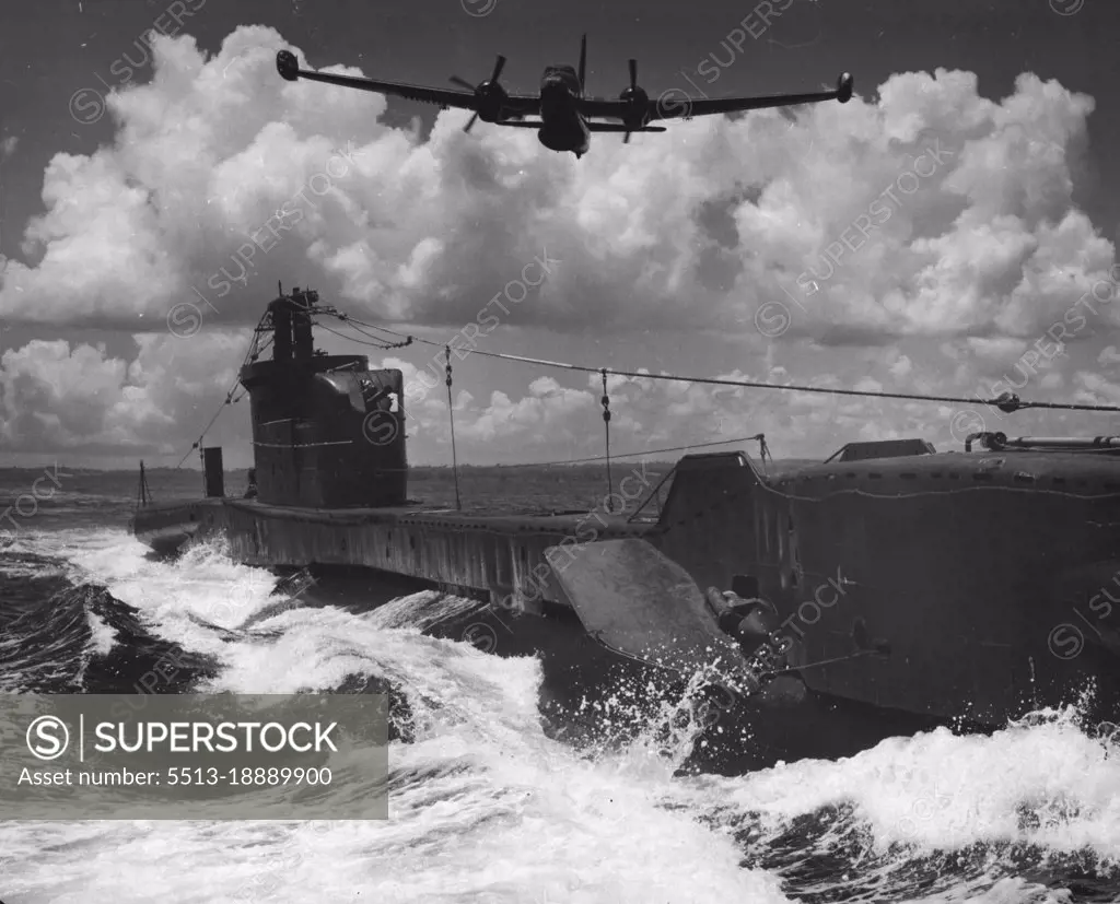 Combined Air Naval Exercises Off Manus Island Now Proceeding: British submarine "Thorough" being attacked by Anti Sub Neptune Bomber. October 15, 1954. (Photo by Alton L. Frazer, Australian Photographic Agency Picture).