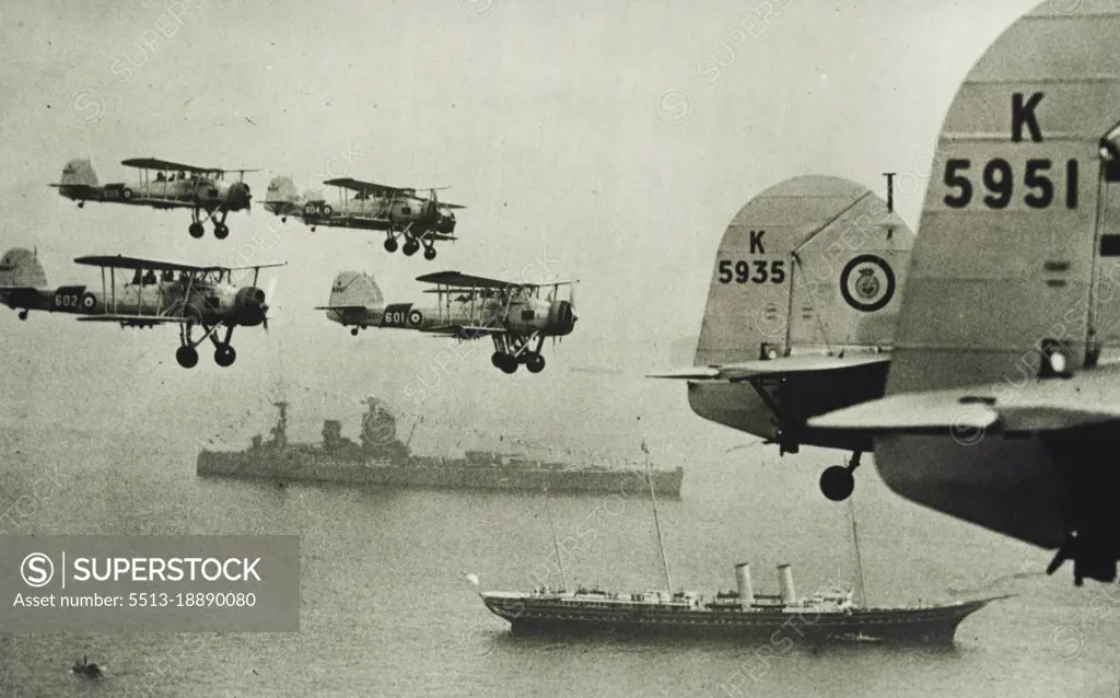 ***** Salute For The King - ***** fly past the Royal ***** Fleet Air Arm in the Coronation Review at Spithead, May. 20th. Picture taken from one of the "Swordfish" squadrons taking part. May 20, 1937. (Photo by Sport & General Press Agency Limited).