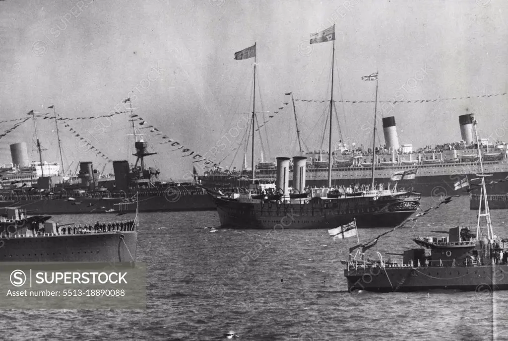 The King's Jubilee Review Of The Fleet At Spithead - The Royal Yacht "Victoria And Albert" with the King and Royal Princess on board, passing through the lines of ships, during the great, Jubilee review of the fleet at Spithead today, July 16.The King made his Jubilee Review of the World's greatest fleet today, July 16, at Spithead. The combined fleets were anchored in majestic precision in a five-mile stretch of the Solent, through which His Majesty passed in the Royal yacht "Victoria And Albert" during his inspection of the might gathering. July 16, 1935. (Photo by The Associated Press Photo Ltd.).