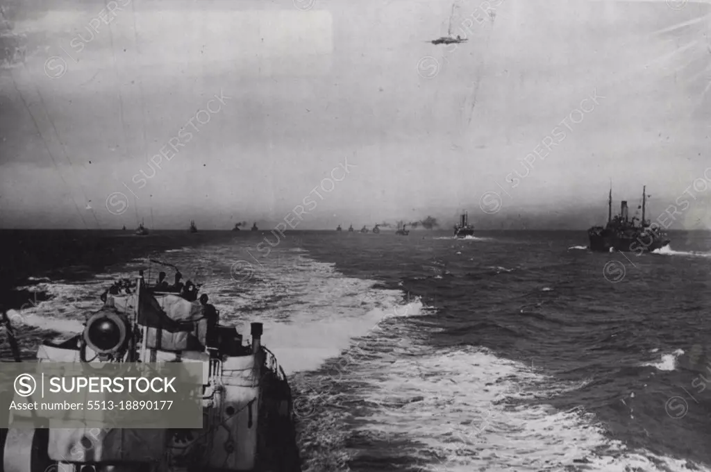 The Nation's Watchdogs: An amazing picture taken from the stern of a destroyers as rounds up the convoy, whilst a 'plane of the Coastal Command patrols overhead.''Above all'', said Mr. Churchill in a recent speech, ''we had to brig in the food and raw materials and finished munitions across the Atlantic in the teeth of the German and Italian U-boats and aircraft''. Our convoys, under the protection making their ***** to all parts of the world and this recent series of pictures, taken on board an escorting destroyer, gives some idea of the life of our seamen, when on convoy duty. February 02, 1942. (Photo by Fox Photos).