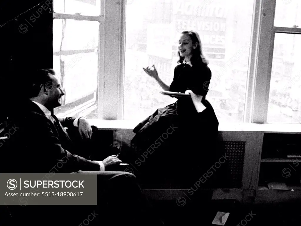 Producer Robert Whitehead smiles his appreciation as Susan reads him a trial script. Although she concentrates hard, she looks relaxed and happy. She likes corny serials. July 8, 1955. (Photo by Look Magazine).