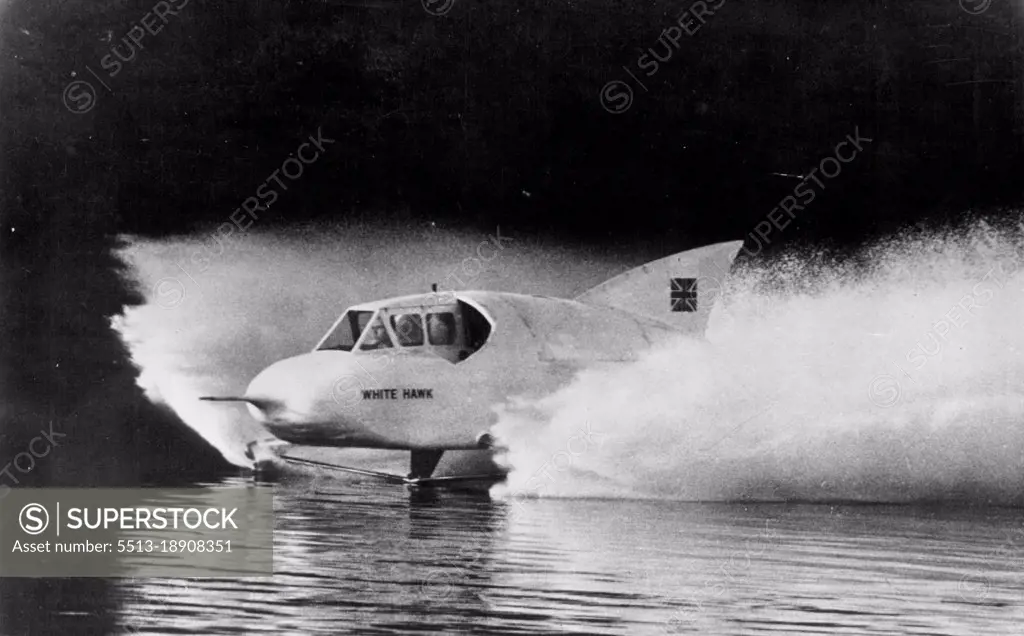 Jet Speedboat Flies Through Water In Test For Record Attempt - Looking like a seaplane about to take off from the water, the White Hawk, jet speedboat equipped with a 6,000 horsepower engine, roars along at 100 miles per hour in test on Lake Windermere, England. Test took place place on Friday in preparation for the attempt on the World's water speed record by Frank Hanning-Lee and his wife. November 2, 1952. (Photo by AP Wirephoto).