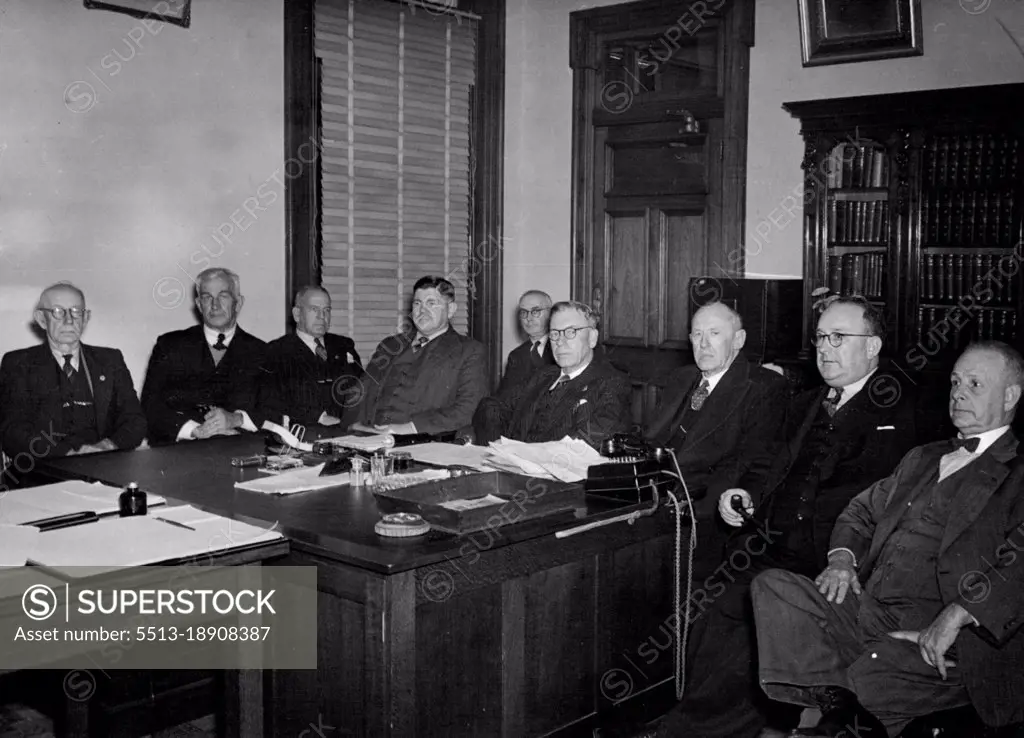 State Cabinet meeting last night when it ordered a secrete ballot to be taken of meat workers on the question of a return to work. From  Left: The Attorney General Mr. Gledson, work Minister Mr. Bruce, Education Minister Mr. William, Transport Minister Mr. Walsh Agriculture Minister Mr. Collins, Premise Mr. Hanlon, Health and Home Affairs Minister. July 26, 1946.