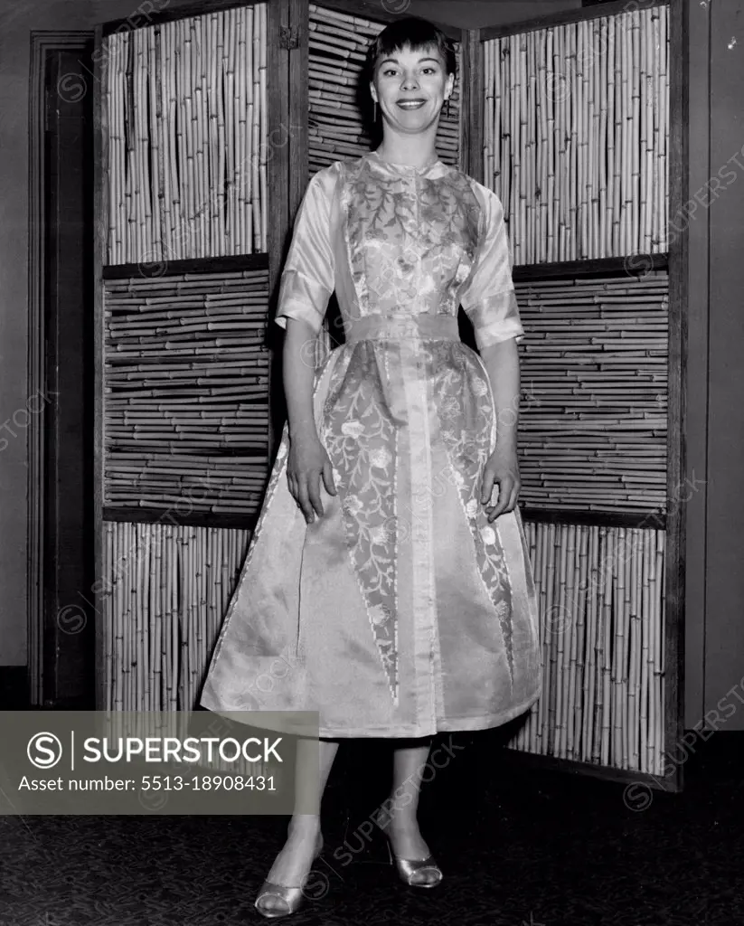 Carol Haney, of "Pajama  Game," choose a flowered silk dress in the old French court mood. Tina Leser is the designer. January 31, 1955. (Photo by Don Rice).