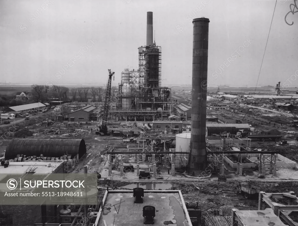 Progress On Isle Of Grain Refinery -- A general view of work in progress on the distillation unit at the new Kent refinery. In the background will be the jetties. April 28, 1952.