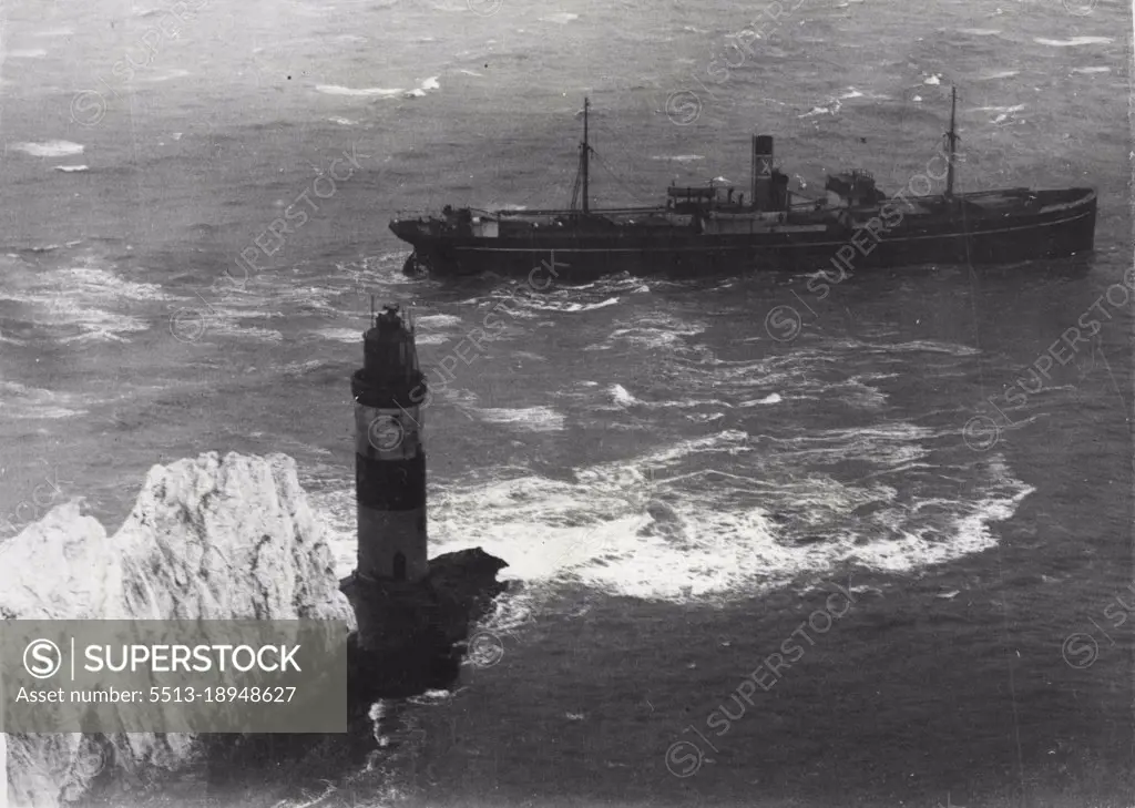 Tugs And Tide Fail To Save Ship Wedged On Rocks.An aerial view taken last night showing the Varvassi still fast on the Needles.The Greek tangerine ship Varvasst, carrying 300 tons of tangerines, went on the rocks at the Needles, Isle of Wight. Lloyds experts are pazzled why the ship, and tugs which had stood by to drag her off abandoned their attempts. Needles Bridge, one of the three dreaded underwater spikes, is a notorious hazard and "there is a lamp-post on the corner" as one mariner described the Needles Lighthouse.  January 6, 1947. (Photo by Keystone).