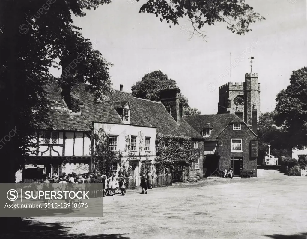 A Village In Kent - Close to the junction of two busy main roads to Canterbury lies Chilham. It is one of the many beautiful villages in this of Kent and as will be seen by this picture, it retains the peaceful air of a less strenuous age. August 28, 1933.