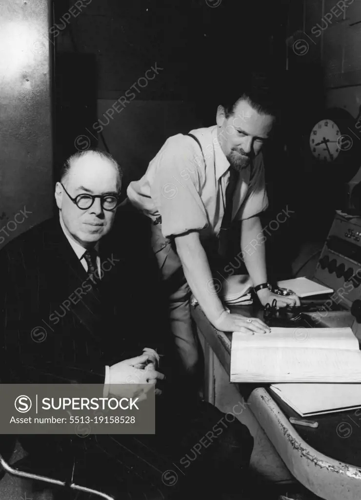 Wyndham Lewis Listens To "The Childermass" -- Wyndham Lewis author and painter, listens to a rehearsal of "The Childermass", his book which was recently adapted for radio and broadcast in the British Broadcasting Corporation's Third Programme. Behind him is D.G. Bridson, BBC feature producer, script writer and poet, who collaborated with Wyndham Lewis in the adaptation. Following on the successful broadcast of Part I of "The Childermass" - a book which was primarily conceived as a trilogy - the BBC has now commissioned Mr. Wyndham Lewis to complete Part II. October 10, 1951. (Photo by British Broadcasting Corporation).