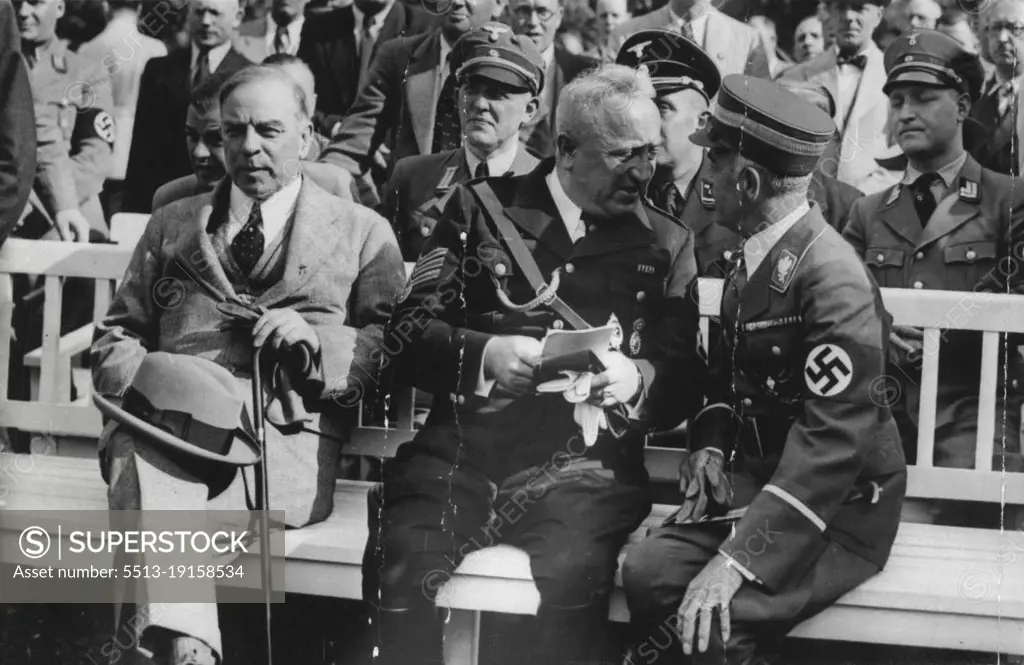 Canadian Premier at Nazi Meeting -- Mr. Mackenzie King (left) with Dr. Ley (centre) and Herr Hans Von Tschammer-Osten, German Sports Leader, at the meeting of the German Labour front at the ***** Stadium, in Berlin. Dr. Ley, on this occasion, announced that participation in active sports would in future be cumpulsory to every Great German firm.Mr. Mackenzie King, the Canadian Premier, paid a visit of several days Herr Hitler and prominent members of the Nazi Cabinet. July 01, 1937. (Photo by Keystone).