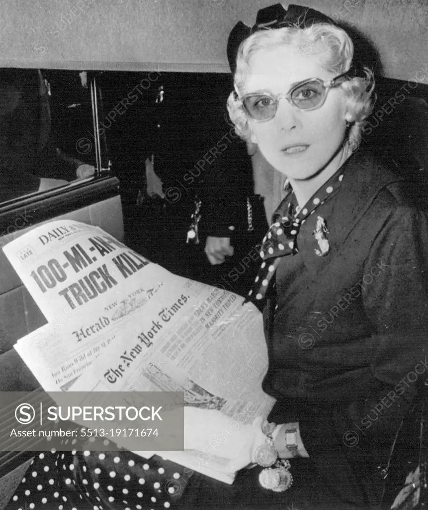 Catching Up With The News - Clare Boothe Luce, U.S. Ambassador to Italy, scans headlines of newspapers in limousine at International Airport today shortly after arrival from Rome. She said she wanted to "deny the many rumours that she will succeed Mrs. Oveta Culp Hobby as Secretary of Health, Education and Welfare," and added she had returned for a summer vacation. May 28, 1955. (Photo by AP Wirephoto).