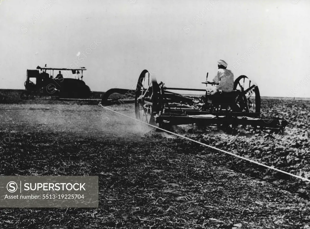 Deal On The Nile. The Gezira Cotton Scheme -- Large scale ploughing of more difficult soil is done by big ***** ploughs Engines stationed either end of huge fields draw plough back ***** and forwards on cables between them. This method is found more economical ***** efficient than use of tractors. Machines are from pool maintained by cotton company.British Government in Africa has long had its own 'Tennessee Valley' scheme - Gezira Cotton Scheme in the valley area of nearly a million acres between the ***** and white Niles. Plans for the area's development were begun before tee last ***** and 1925 the Sennar Dam, two miles long and over a hundred feet high at ***** point was completed. September 6, 1951. (Photo by British Official Photograph).