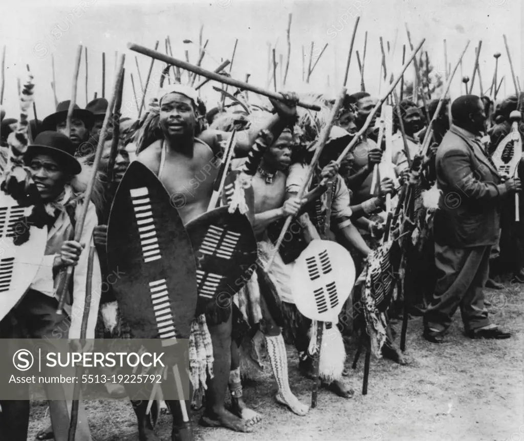 Zulus Honor Nation's Founder -- Zulu tribesmen, some in native dress, others in civilian clothing and still others, in a mixture of each, chant and dance during ceremonies honoring Tahaka, founder of the Zulus, at Stanger, Natal, Africa, recently. A marble monument in honor of Tahaka  was unveiled during the ceremonies, PS: Dig the derby and porkpie hats at left. October 03, 1954. (Photo by AP Wirephoto).