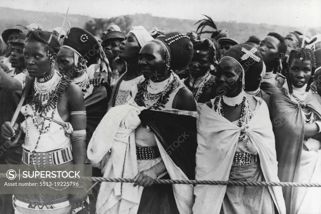 Zulus Greet Royal Family -- The Royal Family had their first view of Zulus when they were greeted by these bead-bedecked women at Waggon Bridge, Ladysmith, on the occasion of crossing the border from the Orange Free State into Natal. Their Majesties were welcomed at Ladysmith by General Smuts and nearly 3,000 South African Indians, the whole Indian population of Ladysmith. March 18, 1947.