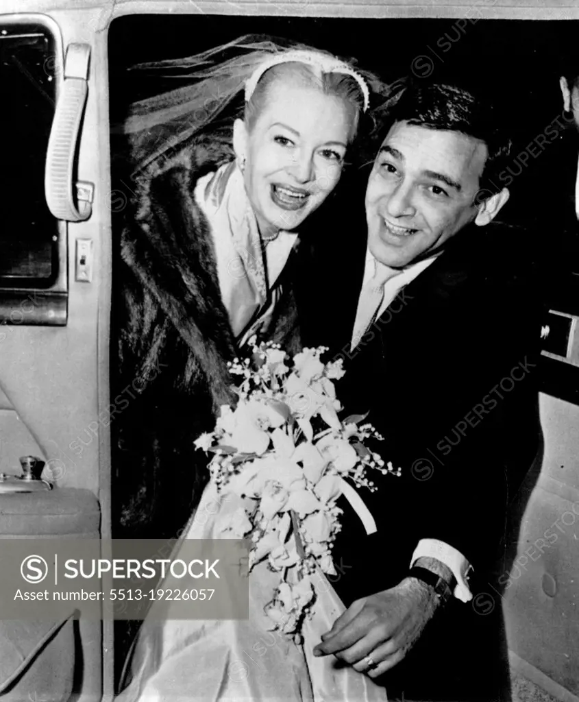 Smiling Newlyweds. Actress Marilyn Maxwell and screen writer Jerry Davis enter a car outside Community Church, New York, after their marriage recently. The couple plan to settle in Hollywood and will honeymoon at Apapulca. November 26, 1954.