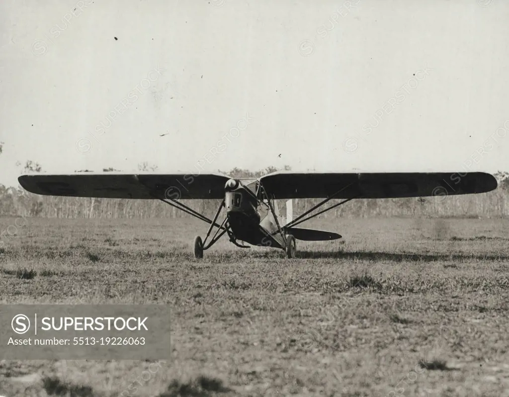 Attracted Attention -- Painted a brilliant yellow, Captain Matthews' Puss Moth was a centre of interest after the aviator landed at Eagle Far yesterday.January 20, 1931. (Photo by Brisbane Daily Mail Ltd.).