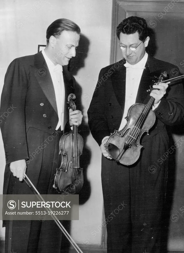 Yehudi Menuhin At Viennese Festival -- Yehudi Menuhin (left) and Professor Wolfgang Schneiderhan in the Vienna concert hall.Highlight of the Vienna festival was the musical performance with star artists Yehudi Menuhin and Professor Wolfgang Schneiderhan playing violin duets and sonatas by Bach, Beethoven and Bartok. June 16, 1953. (Photo by Paul Popper, Paul Popper Ltd.).