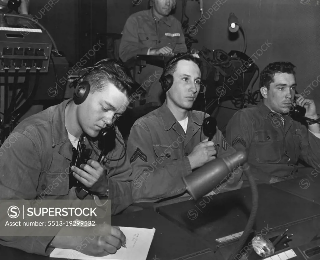 Look To The Skies -- As sky sweeper batteries go into action, technicians at an operations center, fort bliss, Texas, tabulate firing information received from units of the 531st anti aircraft artillery battalion. Shown left to right are: Pvt. Charles R. Jones, Fort Worth, Texas; Cpl. Robert Enders, flint, Michigan and Cpl. Cyril Brown, Oklahoma. December 06, 1954. (Photo by Official U.S. Army Photo).