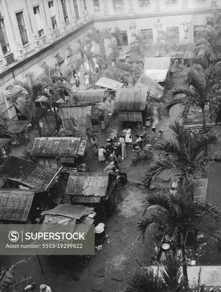 Home For Some 400 Internees -- These rudely constructed shanties at the rear of the Santa Tomas internment camp in Manila, P.I., were the homes of some 400 of the 3,700 internees who were freed by American troops Feb. 5 (Manila Time). The entry of the yanks ended three years imprisonment for the internees. February 13, 1945. (Photo by Associated Press Photo).