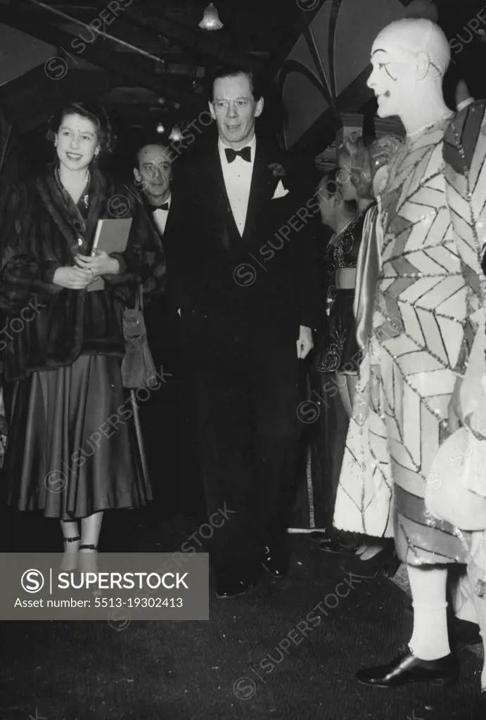 Princess Elizabeth Attends CircusAccompanied by Cyril Mills smiles as she passes Percy Huxter, the clown, when she arrived at Olympic, London, this evening, December 30, to attend Bertram Mills Circus. Behind them (centre background) is Bernard Mills. December 30, 1948. (Photo by Associated Press Photo).