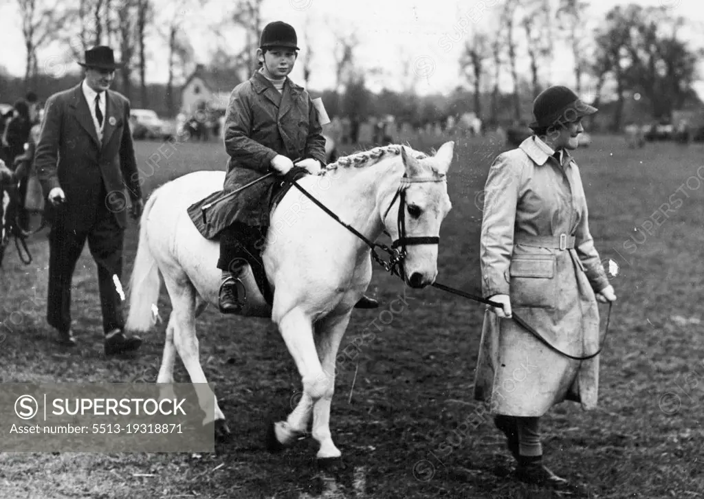 Royal Jumper At Iver Village Horseshow -- Prince Michael of Kent on his white pony "Pearl", pictured as he is led up to the start of the Class II event at Iver Village Children's Horseshow and Gymkhana (Huntsmoor Park, Monday).He won a second prize. April 11, 1950. (Photo by Fox Photos).