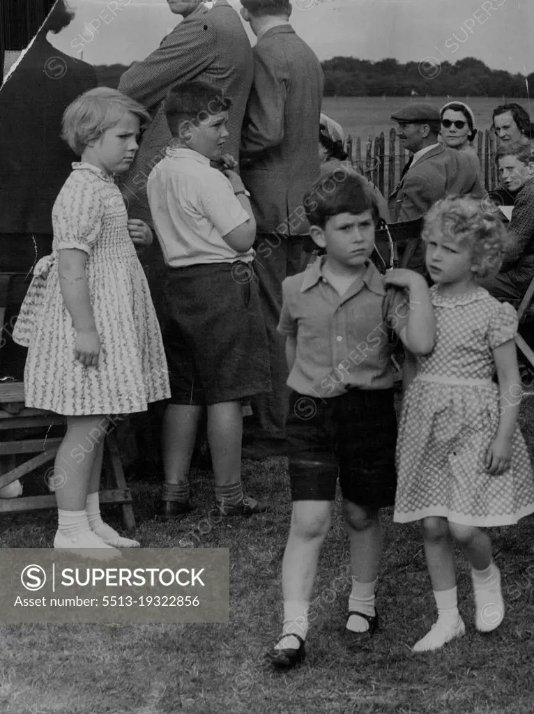 "Don't look now but there's somebody watching us."Princess Anne and Prince Charles chatter thoughtfully in a quiet moment at the Household Cavalry polo tournament last week at Windsor Great park.Girl on left seems to be comparing dresses. June 23, 1955.