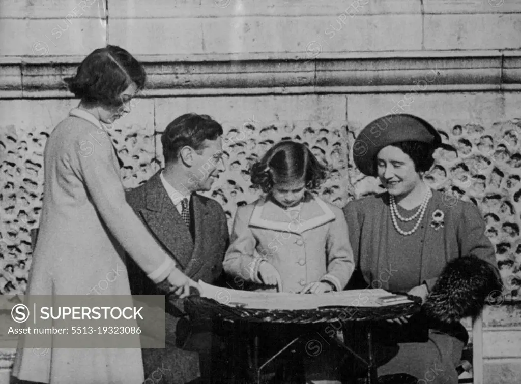 King and Queen Show Princess their Route for North American Tour - The King and Queen showing their route to Princess Elizabeth (standing) and Princess Margaret in the grounds of the Palace.Seated in the sunshine in the grounds of Buckingham Palace, with a large map spread before them, the King and Queen pointed out to Princess Elizabeth and Princess Margaret their route during the visit to Canada and America next month. April 25, 1939.