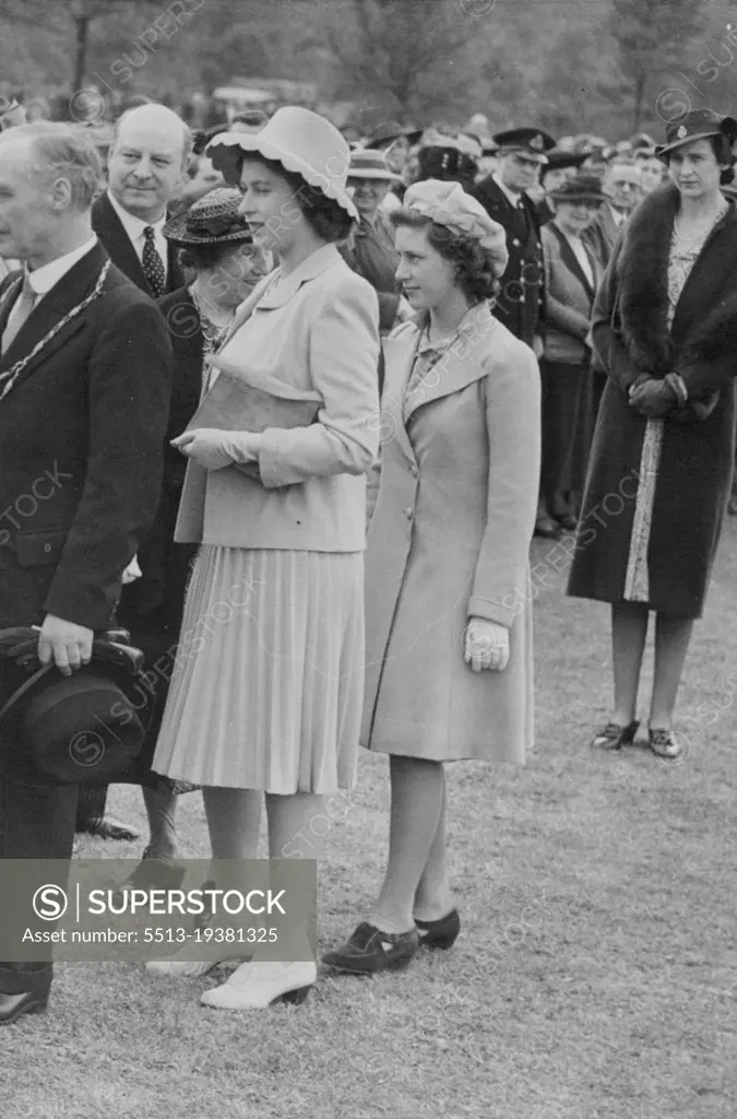 Queen And Princesses At Empire Day Rally -- Princess Elizabeth and Princess Margaret (right) with the Mayor of Windsor at the rally. The Queen, Princess Elizabeth and Princess Margaret attended the Empire Day Day children's rally in Home Park, Windsor, two bands and Uncle Mac of the B.B.C. entertained the children. Community singing and a march-past rounded off the afternoon. January 01, 1944.