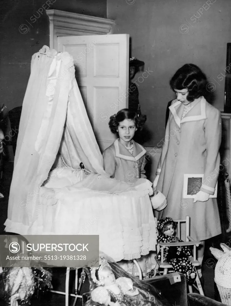 Princesses View Their Own Cot At Exhibition -- Princess Elizabeth (right ***** Princess Margaret Rose viewing the ***** both used as babies and which is now ***** was formerly their nursery.Princess Elizabeth and Princess Margaret Rose visited their old home. No.145, Piccadilly, London residence of the King and Queen when Duke and Duchess of York, to view the Exhibition of Royal and Historic Treasures, to which they, with other members of the Royal Family have contributed exhibits. The Queen recently visited the Exhibition with the King and was so impressed that she decided that the Princesses should go, too. July 28, 1939.