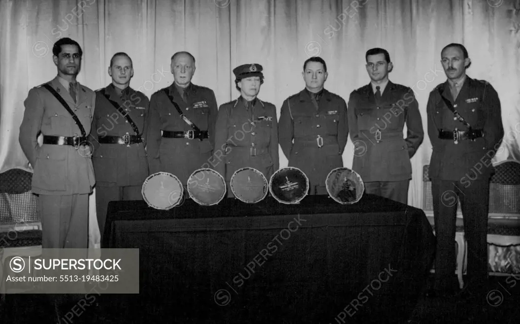 The Princess Royal presents Silver Salvers to Canadian, Australian, South African, New-Zealand and Indian Signal Corps on behalf of the Royal Corps of Signals, at the Hyde Park Hotel. The Group after the presentation, Left to right:- Major M.M. Batra, Indian Signals Corps, Major E.K. Collet, New Zealand Signal Corps, Major General G.G. Rawson C.B., O.B.E., M.C. Col., Commandere of Royal Corps of signals. H.R.H. Princess Royal Col. In-Chief of the Royal Corps of Signals, Lieutement Colonel P.A. Kellough, Royal Canadian Corps of Signals, Major K.R. Colwill Australian Corps of Signals and Major J.C.R. gardner of South African Corps of Signals. January 11, 1946. (Photo by Sports & General Press Agency Ltd.)