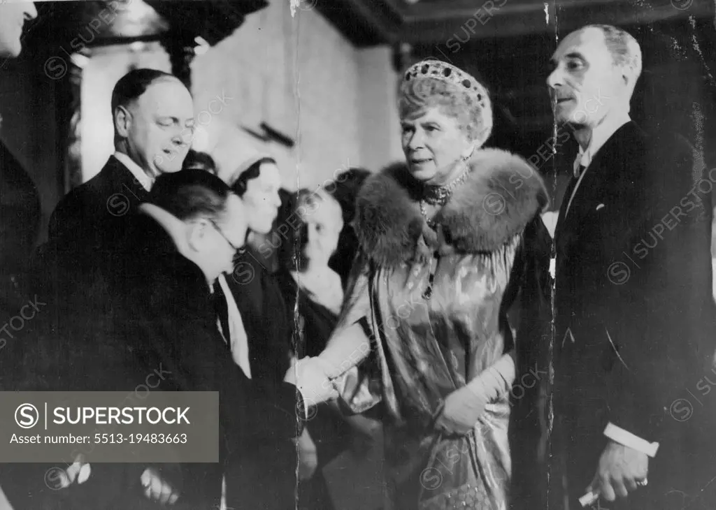 Queen Mary Attends Film Premier -- Queen Mary being received at the Plaza Theater on her arrival this evening. Queen Mary this evening attended the film premier of " Midnight " at the Plaza Theatre Haymarket. The premiere was in Aid of the Princess Beatrice Hospital. May 11, 1939. (Photo by Keystone).