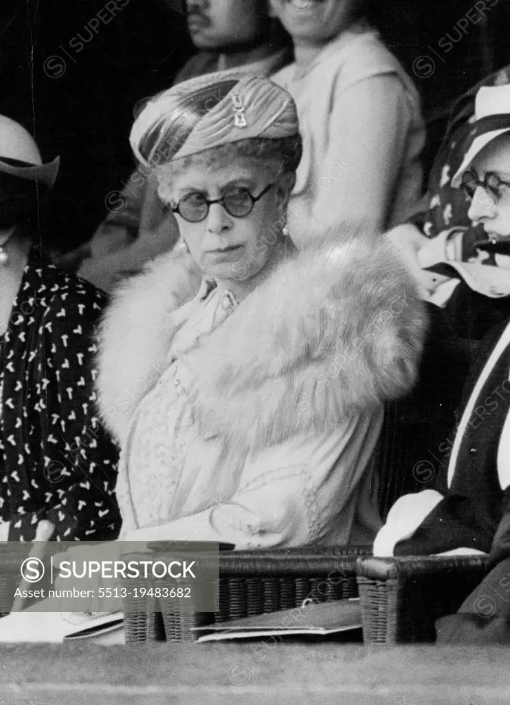 The Queen At Wimbledon Semi-Finals -- The Queen following with great interest the game between Von Cramm and Budge at Wimbledon today July 3. The Queen attended the Wimbledon championship meeting this afternoon. Her Majesty arrived during the Semi-Final match between Baron Von Cramm (Germany) and D. Budge (U.S.A) and was greeted by a burst of cheering. August 12, 1935. (Photo by Associated Press Photo).