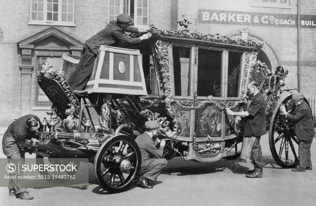 The Speaker's State Coach Made Ready For The Jubilee Celebrations After Twenty- Five Years Of Idleness -- When the Speaker of the House of Commons, Captain Fitzroy, rides in the coach in the King's Silver Jubilee processions through London, it will be the first time it has been on the road since the Coronation. The coach is more like the Lord Mayor's than the King's it has a box seat and a hammer cloth which the Royal vehicle has not. Workmen putting the finishing touches to the coach after its overhaul. March 28, 1935. (Photo by Sport & General Press Agency Limited).