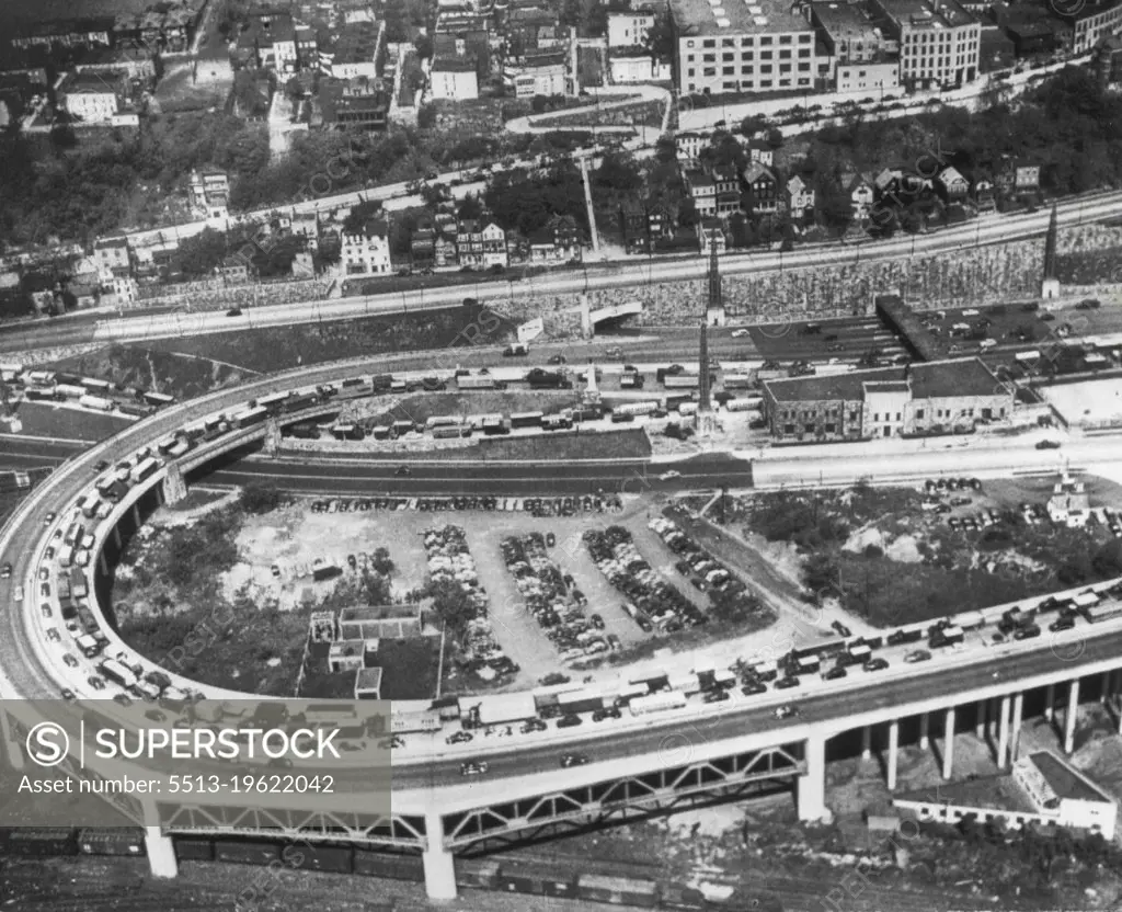 Traffic Jam -- Trucks, autos and buses rerouted from the Holland, Jersey City, blocked today by a truck fire and explosion, inch their way toward entrance of Lincoln Tunnel (top right). The Lincoln Tunnel connects New Jersey and New York north of the Holland Tunnel. May 13, 1949. (Photo by AP Wirephoto).