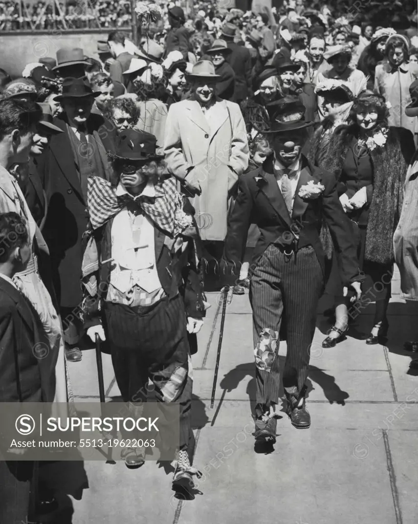 'Gentlemen Of The Road' In Easter 'Finery' -- Just to be a lot different from the parading thousands in all their Easter Sunday finery, George Savage (left) and Tom O'Donnell join throng in Rockefeller plaza, New York, grabed in the comic strip version of the well-dressed hobo wears. It was all in fun and fun for all, to judge from expressions of the spectators. April 17, 1949. (Photo by Associated Press Photo).