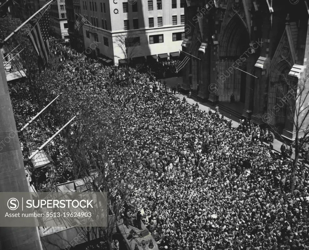 The Big Parade -- Easter Sunday paraders jam fifth avenue in a solid mass in front of St. Patrick's Cathedral and up and down along the Avenue. Men, women and children turned out for one of the biggest parades in New York's history. Police estimated that one and one-half million persons took part in and watched the parade. This overhead scene was made at 50th Street and Fifth Avenue. April 17, 1949. (Photo by Associated Press Photo).