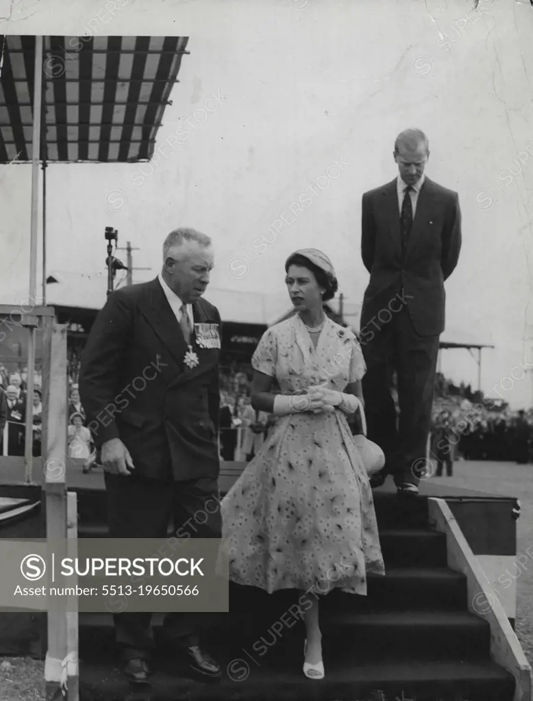 Rally: The Queen descends the dais with Major General Richardson after the Duke (in background) had addressed ex-servicemen at Newcastle Showground. February 10, 1954.