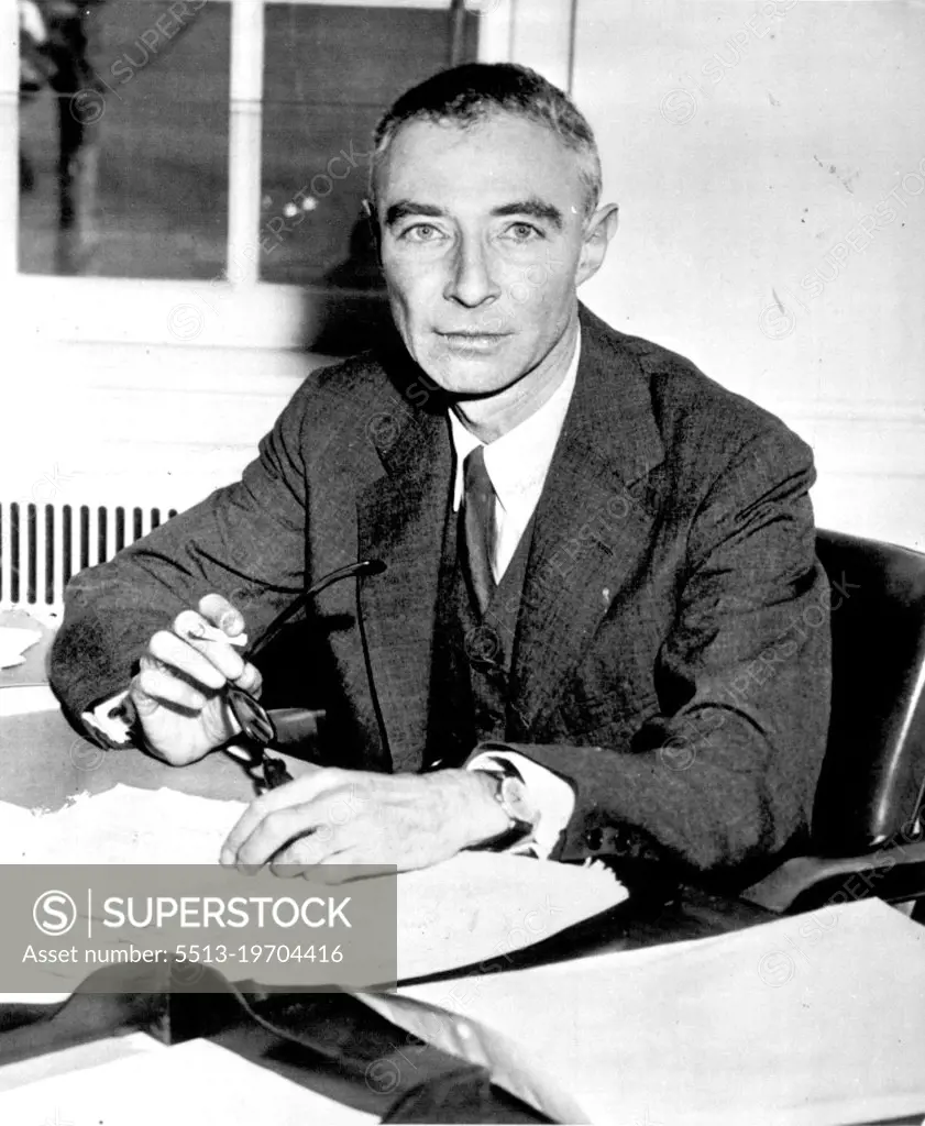 "Not Property Adjudicated Yet" - Atom scientist Dr. J. Robert Oppenheimer ,whom a special Atomic Energy Commission board recommended be barred from atomic secrets,poses here today at his desk at institute for Advanced study which he heads. Oppenhelmer told a newsman,"I know you are here for a comment.I have said this thing is not properly adjudicated yet. I have told the public all about it beforehand I have nothing more to say now." June 2, 1954. (Photo by AP Wirephoto).