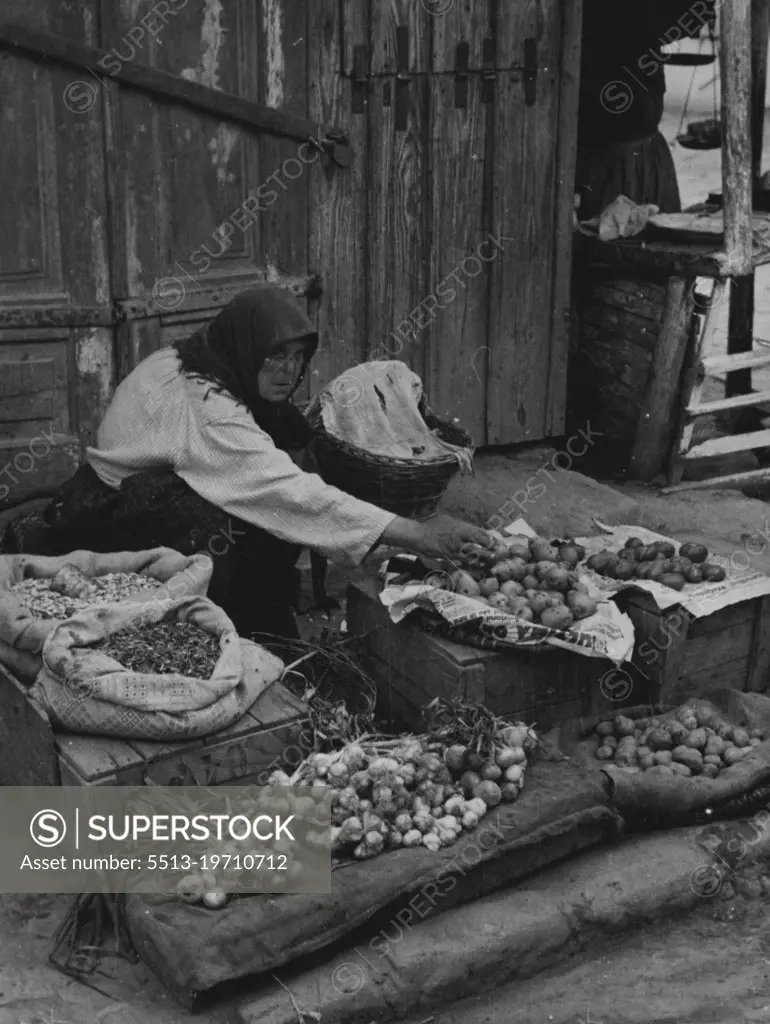 Bessarabia, Former Province of The U.S.S.R.A Bessarabian peasant selling vegetables in the street of Hotin, Northern Bessarabia, a town which may assume great political significance. November 16, 1939. (Photo by Kosmos Press Bureau (Australasia) Pty. Ltd.).