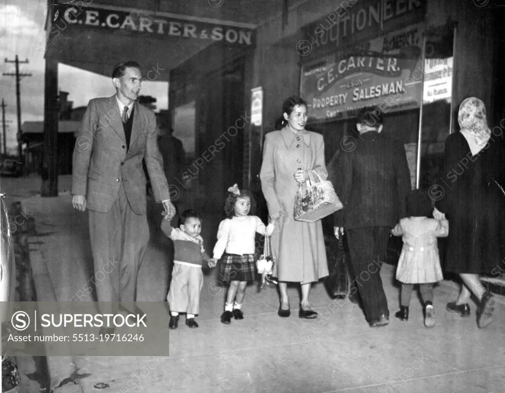 Japanese wife, Cherry Parker went shopping in Melbourne yesterday with her  husband Gordon Parker and their children. May 28, 1953. - SuperStock