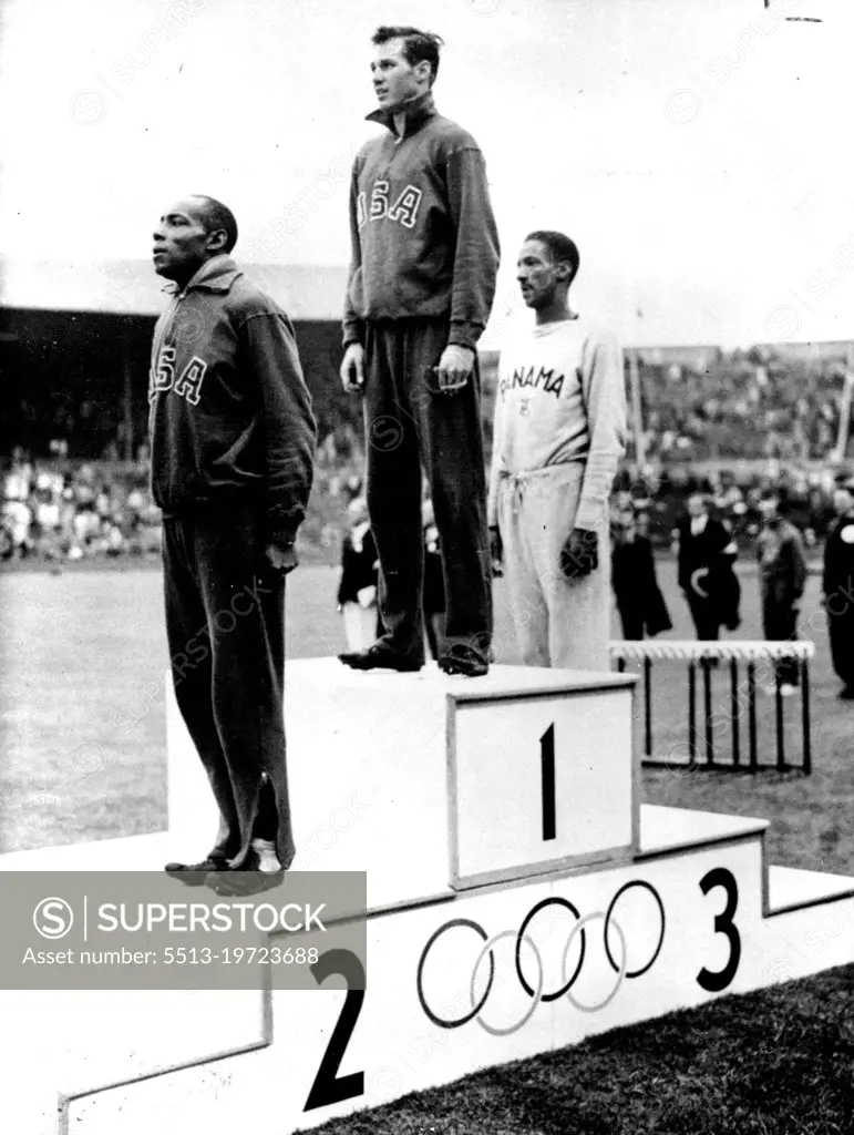 Olympic Games - Final of two hundred metres.Mel Patton (USA) (centre), is seen after winning the Final of the Olympic Men's 200 Metres in 21.1 seconds at Wembley (Aug. 3rd) At left is H.N. Ewell of U.S.A, who gained second place and at right Lloyd Labeach of Panama who gained third pace. August 03, 1948. (Photo by Reuterphoto).