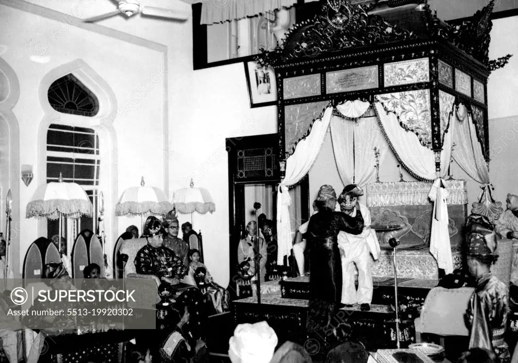 A Sultan Is Enthroned in Malaya -- As the new Sultan of Perak is installed with traditional ceremony at Kuala Kangsar, the chief court Herald whispers the ancestral secret into his car. The secret is never shown to more than two persons at any one time - the chief Herald ***** the ruling Sultan. May 01, 1949.