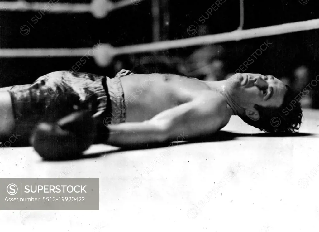 Doyle Knocked Out In The First Round -- Jack Doyle on his back in the centre of the ring after being knocked out in the first round.Eddie Phillips, the Bow (London) heavyweight, knocked out Jack Doyle, the Irish heavyweight, in the first round of their return match at the White City, London to-night They fought last September,when Phillips was the winner Doyle being counted out in the second round after falling out of the ring.The "horizontal heavyweight." Eddie Phillips knocked Doyle out in the first round of their fight at the White City. At their previous meeting Phillips won in the second round. July 10, 1939. (Photo by Topical Press).