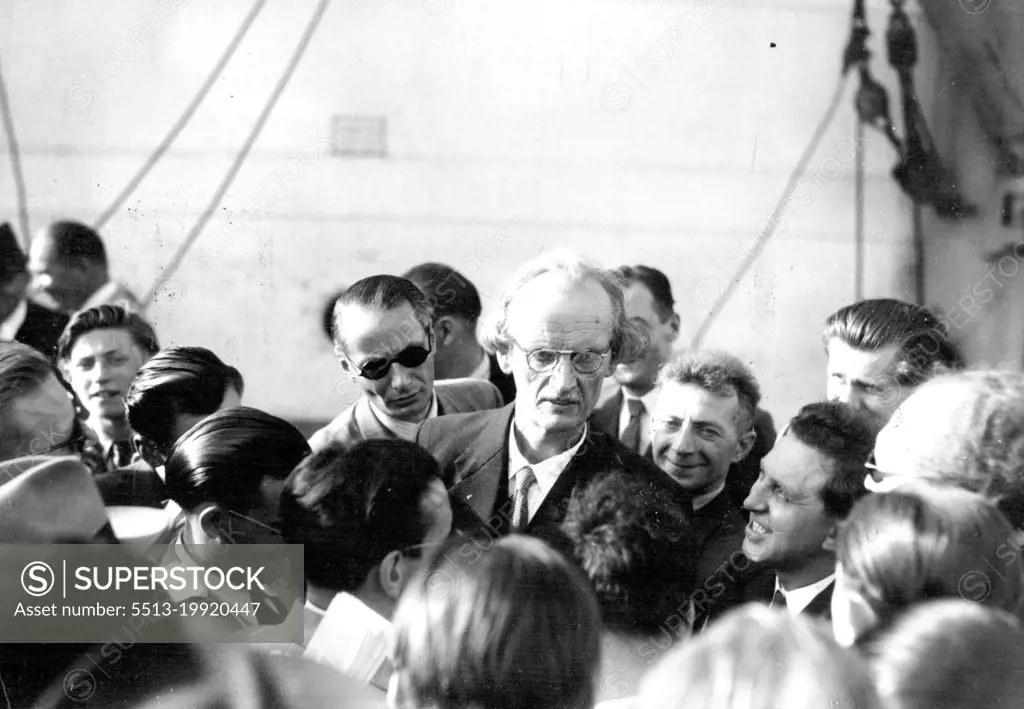 Piccard Leaving On World's Greatest Deep Sea Diving Expedition --Professor Auguste Piccard is surrounded by reporters aboard the 4,000-ton steamer "Scaldis "here just before his departure with his friend and colleague,Professor Max Cosyns, for the Gulf of Guinea, off the coast of West Africa, with their bathyscaphe, for the greatest deep-sea diving expedition of modern times.The Piccard-Cosyns expedition is of much scientific importance - for the man who made the world gasp with - astonishment 17 years ago by going up 10 miles in a balloon, will enter the steel bathyscaphe with his partner Cosyns - and descend 2½ miles into the black depths of the ocean. September 07, 1955.