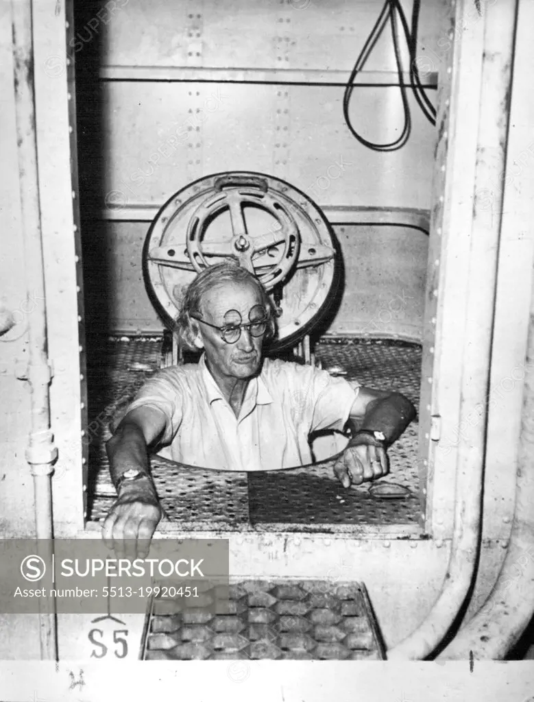 Famous hinged spectacles, the Professor enters the airlock. October 1, 1953. (Photo by The Sunday Herald)