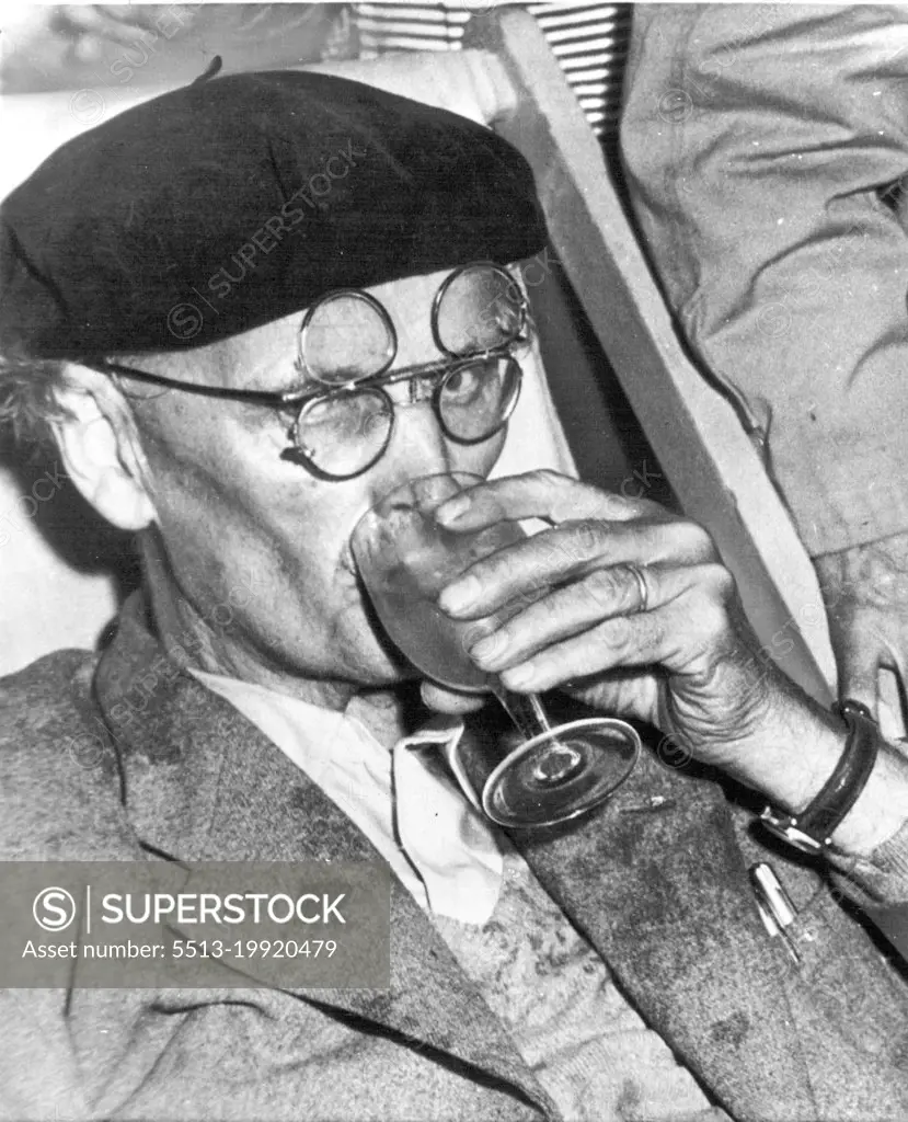 More Water For Piccard -- Prof. Auguste Piccard, Swiss-born scientist, sips a glass of water after his record dive of 10,330 feet to the bottom of the Tyrrheanian Sea off the island of Ponza, September 30. Piccard and his son Jacques rode their odd diving boat, the Trieste, to the bottom as two Italian naval corvettes stood by after one of them had towed the diving boat into position. October 04, 1953. (Photo by AP Wirephoto).